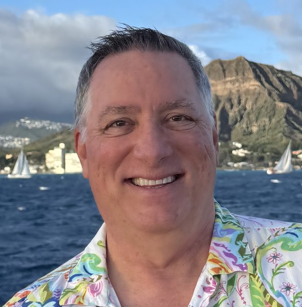 Shawn O. Kelly, founder of Olaf LLC, with Diamond Head and the Honolulu coastline behind him